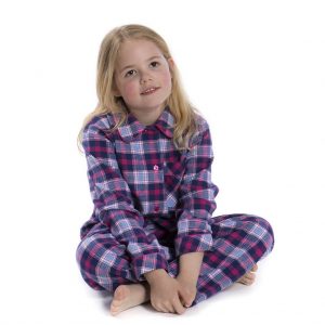 Girl sitting with legs crossed in Brushed Cotton Pink and Navy Check Pyjamas for Girls