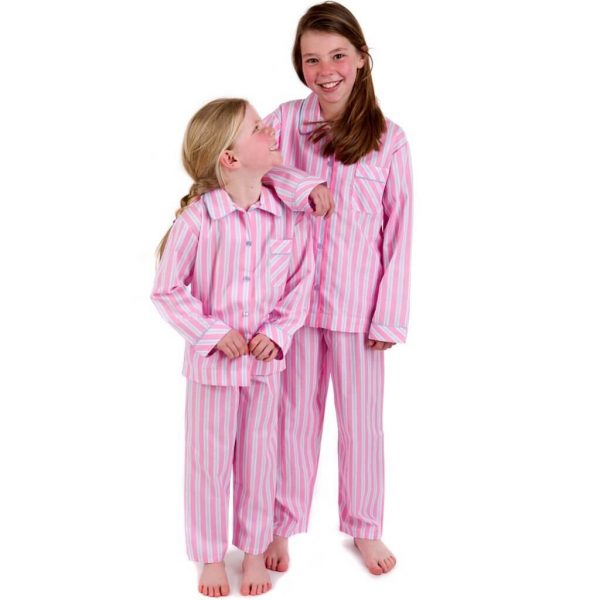 Sisters wearing Pyjama House Fine cotton girls pyjamas in pale pink stripe
