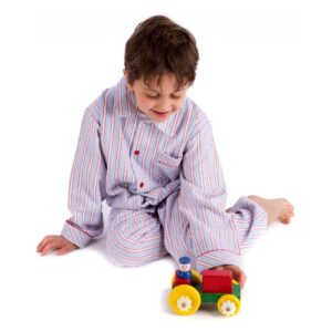 Boy pushing tractor wearing striped pyjamas