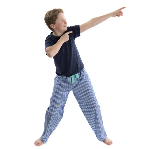 Freddie, aged 12, doing Usain Bolt stance in deep blue and green stripe fine cotton pj bottoms for teens