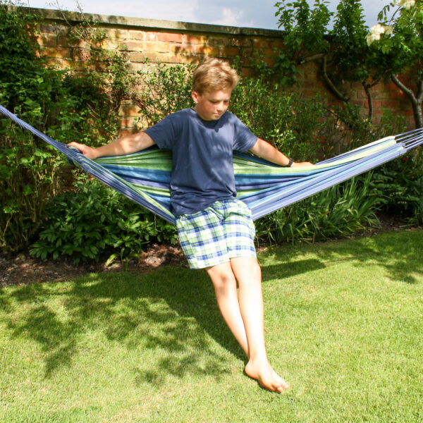 boy on hammock in green check brushed cotton pyjama shorts for boys and men