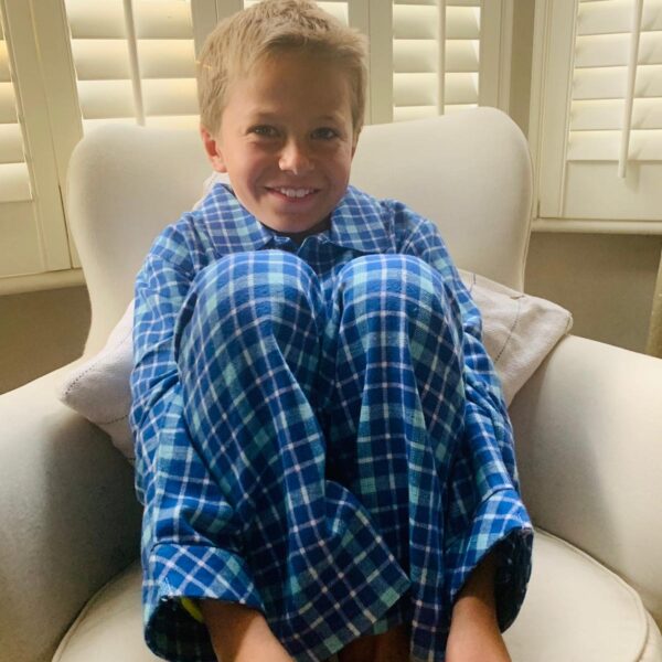 Boy in truquoise check pyjamas